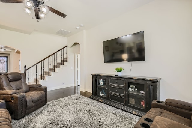 living room with dark hardwood / wood-style floors and ceiling fan