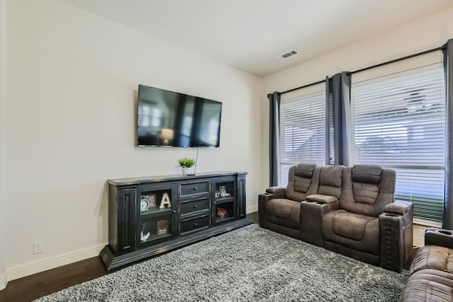 living room with dark hardwood / wood-style flooring