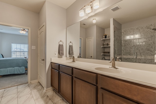 bathroom featuring vanity, ceiling fan, and an enclosed shower