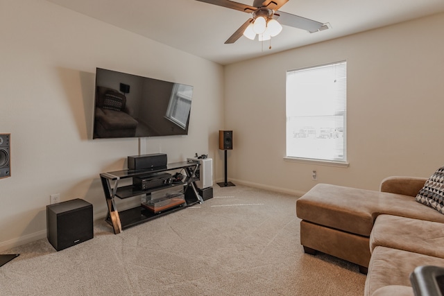 living room with light carpet and ceiling fan