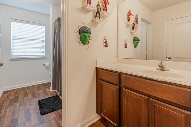 bathroom featuring vanity and hardwood / wood-style flooring