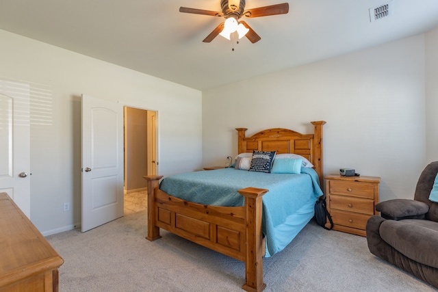 bedroom with light carpet and ceiling fan