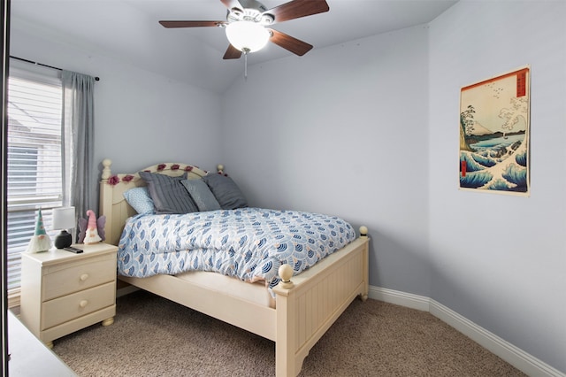 carpeted bedroom with vaulted ceiling and ceiling fan