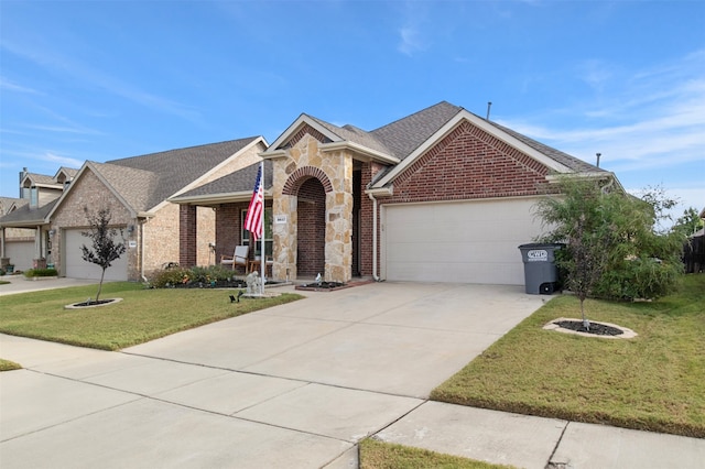 view of front facade with a front yard and a garage