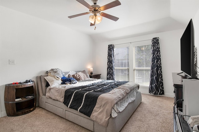 carpeted bedroom featuring lofted ceiling and ceiling fan