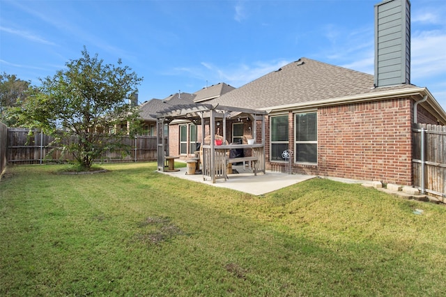 back of house with a patio, a lawn, and a pergola