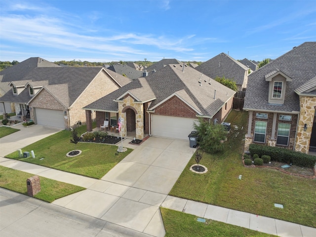 view of front of property with a garage and a front lawn