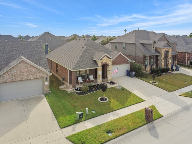 view of front of property with a front yard and a garage