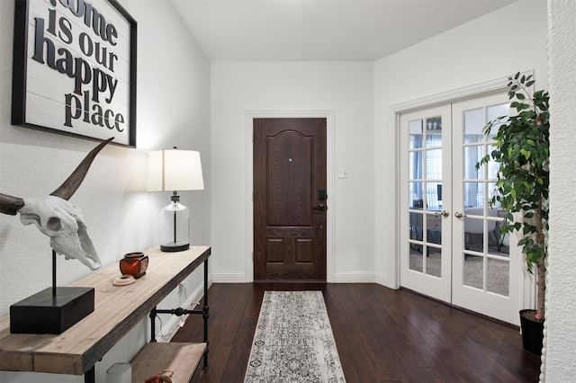 foyer entrance featuring french doors and dark hardwood / wood-style flooring