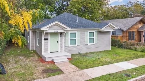 bungalow with a front lawn