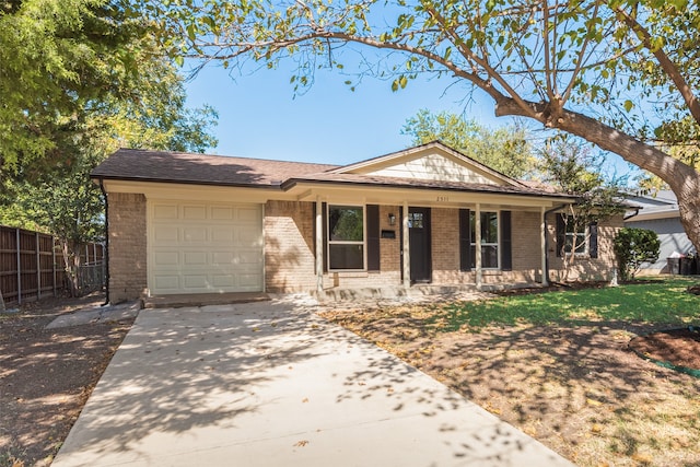 ranch-style house with covered porch and a garage