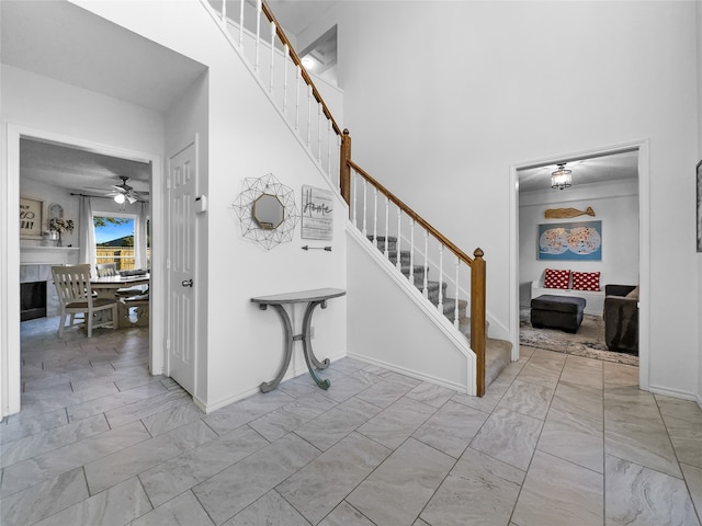 staircase with ceiling fan