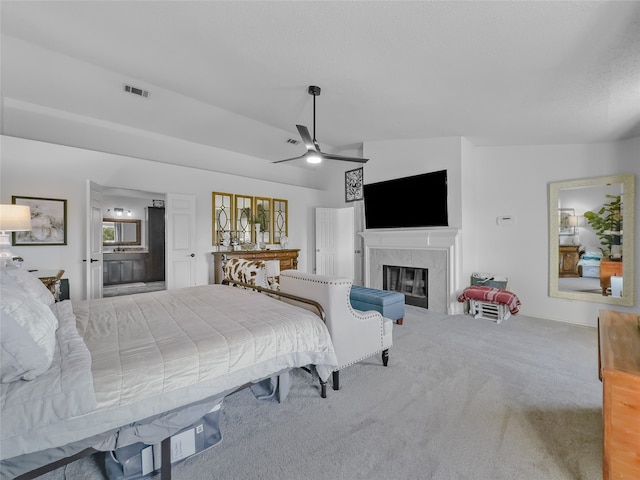 carpeted bedroom featuring lofted ceiling and ceiling fan