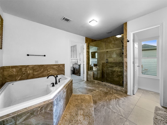 bathroom featuring separate shower and tub