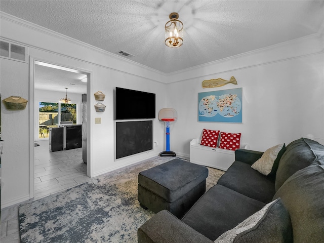 living room featuring a textured ceiling and ornamental molding