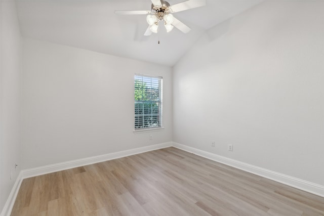 unfurnished room featuring ceiling fan, light hardwood / wood-style floors, and vaulted ceiling