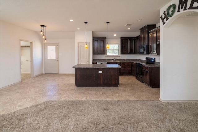 kitchen with light colored carpet, black appliances, hanging light fixtures, and a kitchen island