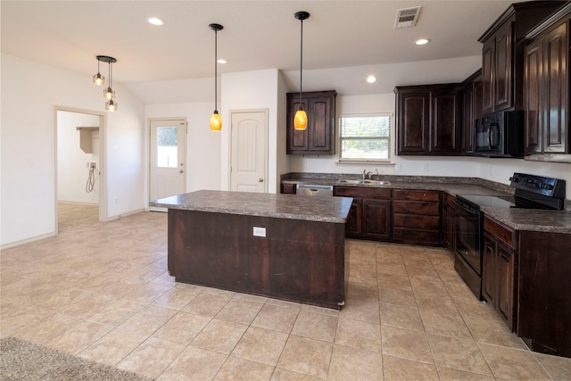 kitchen with sink, black appliances, pendant lighting, and a healthy amount of sunlight