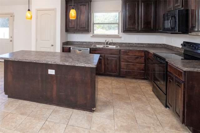 kitchen featuring black appliances, dark brown cabinets, and a wealth of natural light