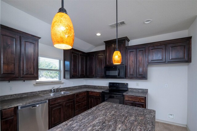kitchen with a sink, black appliances, dark brown cabinetry, decorative light fixtures, and visible vents