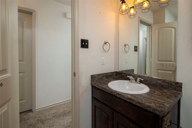 bathroom featuring vanity and an inviting chandelier