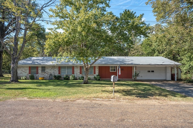 ranch-style house with a front yard and a garage