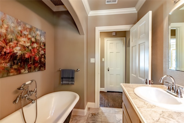 bathroom with vanity, ornamental molding, and a bath