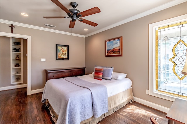 bedroom featuring dark hardwood / wood-style flooring, crown molding, and ceiling fan