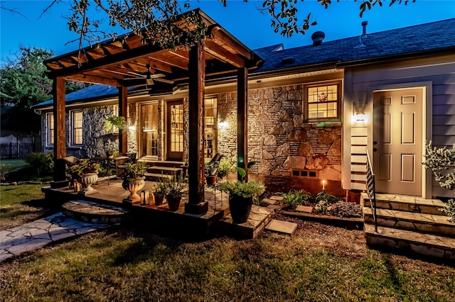 exterior space with a patio area, ceiling fan, a yard, and a pergola