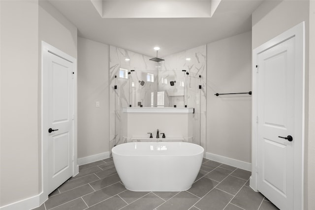 bathroom featuring tile patterned floors and shower with separate bathtub