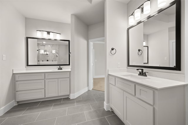 bathroom featuring tile patterned flooring, walk in shower, and vanity