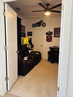 interior space with ceiling fan and carpet floors