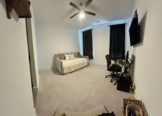 carpeted bedroom featuring ceiling fan