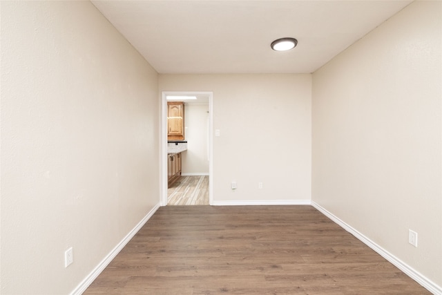 empty room featuring hardwood / wood-style floors