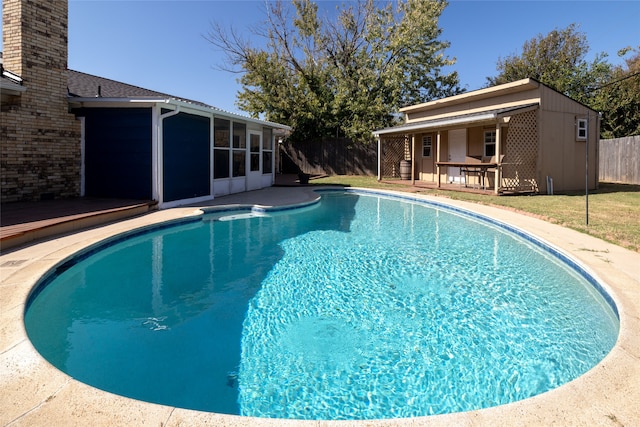 view of pool featuring a sunroom