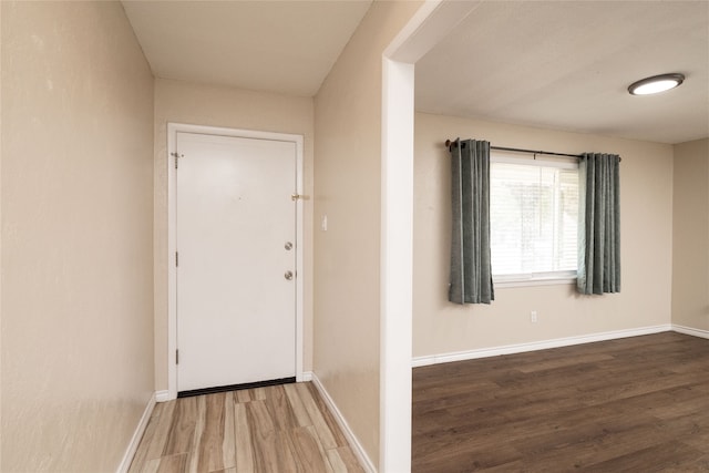 foyer entrance with hardwood / wood-style flooring