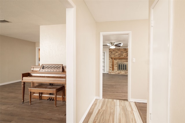 corridor featuring wood-type flooring