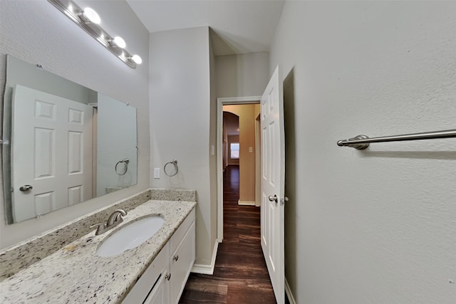 bathroom with vanity and wood-type flooring