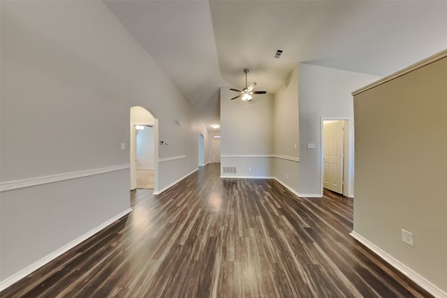 unfurnished living room with dark hardwood / wood-style floors, high vaulted ceiling, and ceiling fan