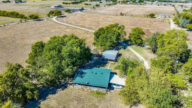 birds eye view of property with a rural view