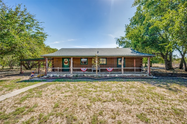 view of front facade with a front lawn and a porch