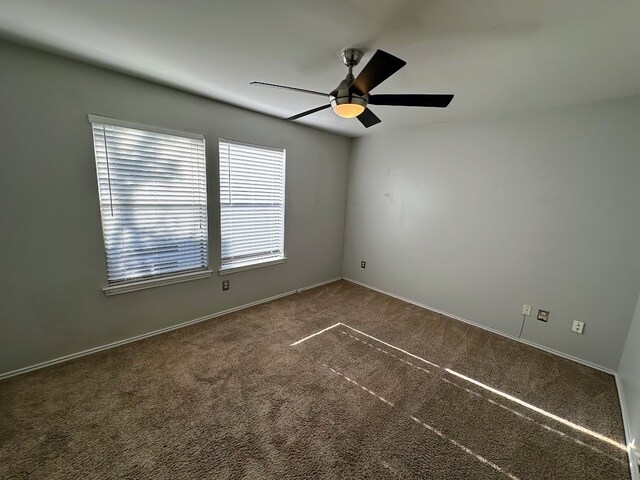 empty room with carpet and ceiling fan