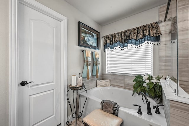 bathroom featuring shower with separate bathtub and wood-type flooring