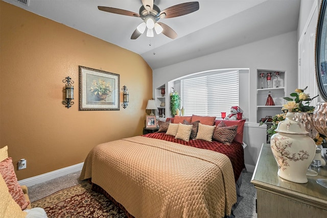 carpeted bedroom with vaulted ceiling and ceiling fan