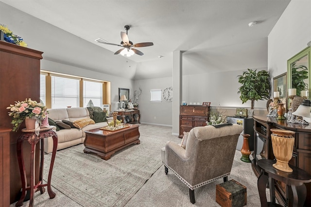 carpeted living room featuring lofted ceiling and ceiling fan