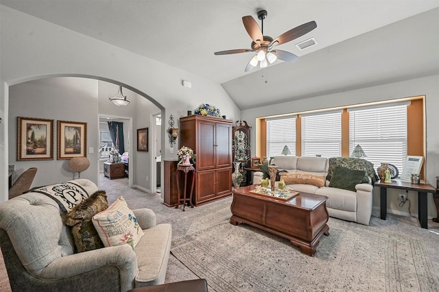 living room with light carpet, ceiling fan, and vaulted ceiling