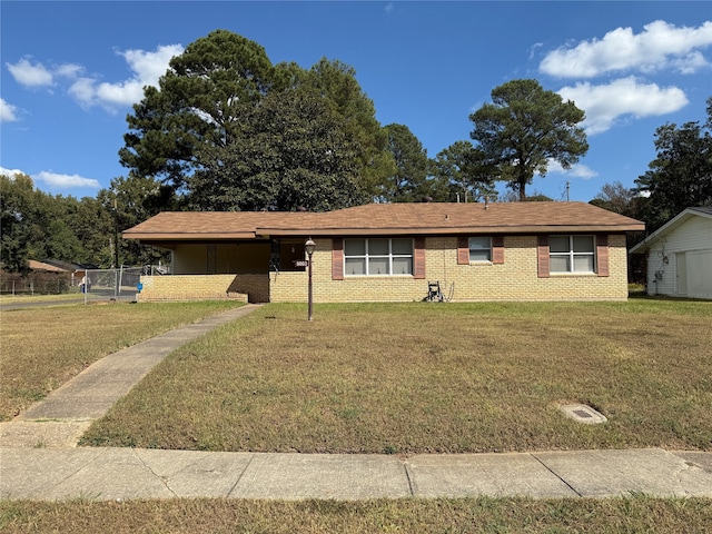 ranch-style house with a front lawn and a carport