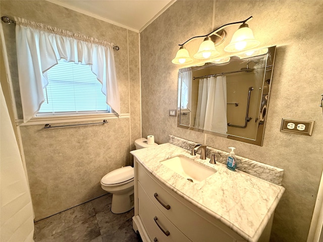 bathroom with walk in shower, crown molding, vanity, and toilet