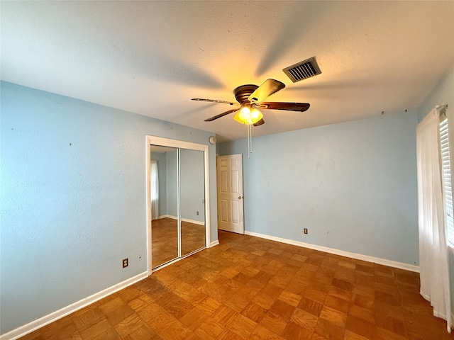 unfurnished bedroom with ceiling fan