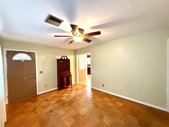 foyer entrance featuring ceiling fan